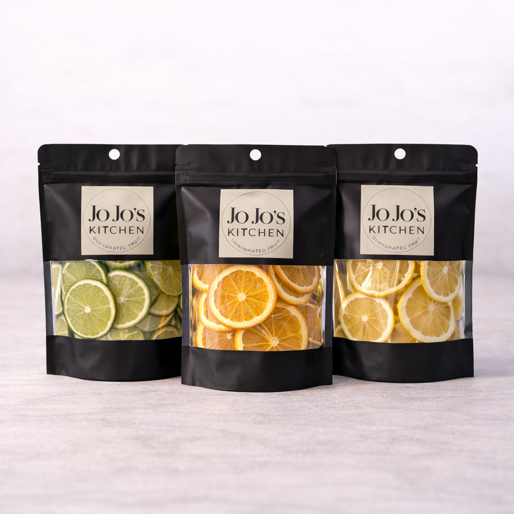 Dried citrus wheel mix for cocktails on white background; Mixed dehydrated lemon, lime and orange slices